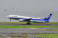 JA8969 @ RJTT - Taking off in the rainy morning - by JPC