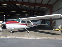 N2874E @ KRHV - A Cessna T210 sitting inside the Lafferty Aircraft Sales hangar for sale. - by Chris L.