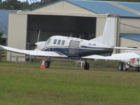 ZK-JQK @ NZKK - long shot from terminal showing skydive door - by magnaman