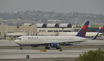 N1613B @ KLAX - Taxiing to gate at LAX - by Todd Royer