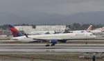 N588NW @ KLAX - Landing at LAX on 7R - by Todd Royer