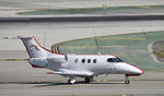 N580JS @ KLAX - Taxiing to parking at LAX - by Todd Royer