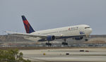 N139DL @ KLAX - Landing at LAX on 7R - by Todd Royer