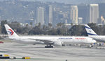 B-2005 @ KLAX - Taxiing to gate - by Todd Royer
