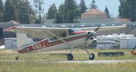 N180LJ @ KRHV - A local 1973 Cessna 180J landing on runway 31R at Reid Hillview Airport, CA. - by Chris Leipelt