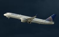 N596UA @ KLAX - United, is here climbing out at Los Angeles Int'l(KLAX) - by A. Gendorf