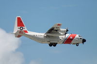 1502 @ KSRQ - A US Coast Guard HC-130 Hercules (1502) from Air Station Clearwater performs a touch and go at Sarasota-Bradenton International Airport - by Donten Photography