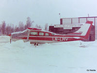 LN-LMV @ ENDU - Scanned from negative. Pictured at a snowy Bardufoss airport, Norway. This aircraft was destroyed in a crash 2004-09-14 - by Clive Pattle