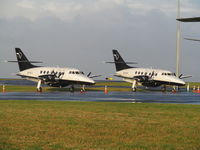 ZK-ECI @ NZAA - with twin (ZK-ECJ) on convair apron AKL - by magnaman