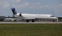 N772SK @ MIA - United Express CRJ-700 - by Florida Metal