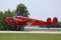 N868L @ KOSH - Beech D18S - by Mark Pasqualino