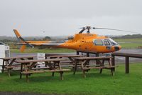 G-ERKN @ EGFH - Visiting Ecureuil helicopter operated by Jet Helicopters Ltd. Note new orange paint job. - by Roger Winser