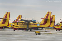 C-GCSX @ CYZF - Parked with 7 other water bombers @ Territorial area at Yellowknife Airport. Overcast day so no flying, but saw it landing last night. - by Remi Farvacque