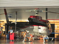 ZK-IDX @ NZAR - One of four ex Era helicopters imported by Oceania aviation. ZK-HFH already processed and two still wearing N reg just un-crated. IDX seen here inside hangar still in smart US colour scheme. - by magnaman