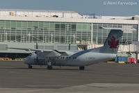 C-GMON @ CYVR - Apologies for low quality of image, taken through scratched window of another craft. - by Remi Farvacque