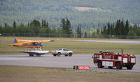 C-GZXV @ CYXY - On floats, being launched from a trailer on a paved runway at Whitehorse, Yukon. - by Murray Lundberg