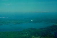 N6995B -  Cub 95B and Bob seen flying east over a very green Calif and a full Lake Camanche as we fly to Calaveras Co airport on this beautiful Easter Sunday. I was flying Tcraft N39246.This of course was a very long time ago and befor global warming took over! - by S B J