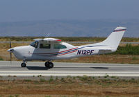 N12PF @ KSQL - Locally-based Cessna T210M taking off @ San Carlos Airport, CA - by Steve Nation