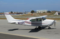 N12PF @ KSQL - Locally-based 1977 Cessna T210M running up @ San Carlos Airport, CA - by Steve Nation