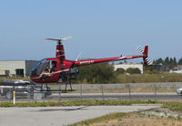 N111AH @ KSQL - San Carlos Flight Center 2004 Robinson R22 BETA hovering at end of training flight @ San Carlos Airport, CA - by Steve Nation