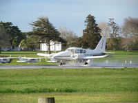 ZK-DIR @ NZAR - winding up on wet runway - by magnaman