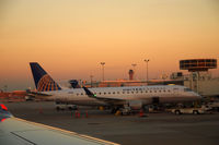 N88327 @ KIAH - Embraer at IAH at sunset. - by Eric Olsen