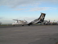 ZK-NET @ NZAA - taxying out for departure - by magnaman