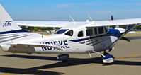 N615KE @ KRHV - Locally-based 2004 Cessna T206H taxing to the TradeWinds hangar for maintenance at Reid Hillview Airport, San Jose, CA. - by Chris Leipelt