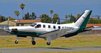 N700PU @ KRHV - TBM Ventures LLC (Pendleton, OR) Socata TBM-700 landing runway 13R at Reid Hillview Airport, San Jose, CA. - by Chris Leipelt