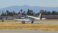 N17621 @ KRHV - California-based 1977 Beechcraft A36 Bonanza taxing back for departure just after landing at Reid Hillview Airport, San Jose, CA. - by Chris Leipelt