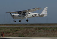 N5207R @ KSQL - Locally-based 2010 Cessna 162 Skycatcher over the threshold @ San Carlos Airport, CA - by Steve Nation