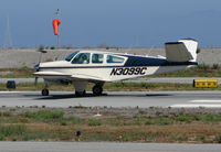 N3099C @ KSQL - Locally-based 1958 Beech K35 Bonanza rolling on takeoff @ San Carlos Airport, CA - by Steve Nation