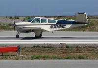 N3099C @ KSQL - Locally-based 1958 Beech K35 Bonanza rolling on takeoff @ San Carlos Airport, CA - by Steve Nation