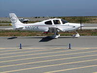 N402CK @ KSQL - Locally-based 2009 Cirrus Design SR22 Turbo taxiing for takeoff @ San Carlos Airport, CA - by Steve Nation