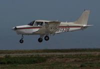 N91338 @ KSQL - Locally-based 1985 Piper PA-28-161 Cherokee over the threshold @ San Carlos Airport, CA - by Steve Nation