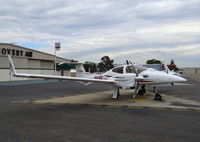 N61EP @ KRHV - North Carolina-based 2014 Diamond DA-42 Twin Star parked on the Nice Air helipads at Reid Hillview Airport, San Jose, CA. - by Chris Leipelt