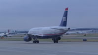 N673AW @ KSJC - US Airways 2004 Airbus A320 taxing out for an early morning departure at San Jose International Airport, San Jose, CA. - by Chris Leipelt