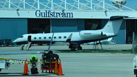 N555GV @ KATW - Black Five LLC (Wilmington, DE) 1997 Gulftsream V sitting in front of the Gulfstream hangar at Outagamie County Regional Airport, Appleton, WI. - by Chris Leipelt