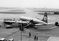 PH-DSH @ EGLL - Disembarking pax at LHR during May 1965.  Poor image, but it was the only camera I could afford. - by Goat66