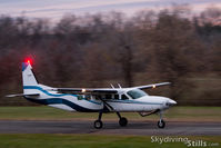 N9454B @ 7B9 - Rolling down the runway with a load of Skydivers. - by Dave G
