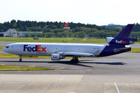 N628FE @ RJAA - At Narita - by Micha Lueck