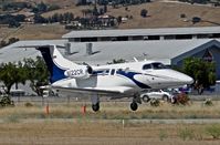 N122CR @ E16 - Locally-based 2013 Embraer Phenom 100 landing at South County Airport, San Martin, CA. Owned by Christopher Ranch LLC, a garlic farm out of nearby Gilroy. - by Chris Leipelt