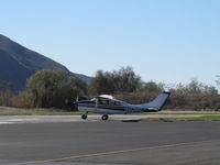 N8388Z @ SZP - 1963 Cessna 210-5(205) UTILINE, (fixed-gear version of 210C), Continental IO-470-E 260 Hp, taking the active - by Doug Robertson