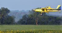 N41850 - Spraying sunflowers just north of Waco, Texas. - by David Tordoff