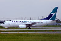 C-FWBW @ CYUL - Boeing 737-7CT [33697] (West Jet) Montreal-Dorval~C 16/06/2005 - by Ray Barber