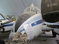 ZK-RNG @ NZWF - in cramped hangar - by magnaman