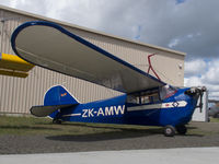 ZK-AMW @ NZNE - Parked at North Shore - by alanh