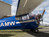 ZK-AMW @ NZNE - Parked at North Shore - engine cowlings removed - by alanh