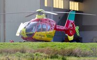 G-KRNW @ EGFH - Visiting air ambulance helicopter on the Wales Air Ambulance apron. - by Roger Winser