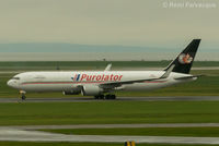 C-FGSJ @ CYVR - Taxiing to Purolator hanger after landing on north runway. - by Remi Farvacque